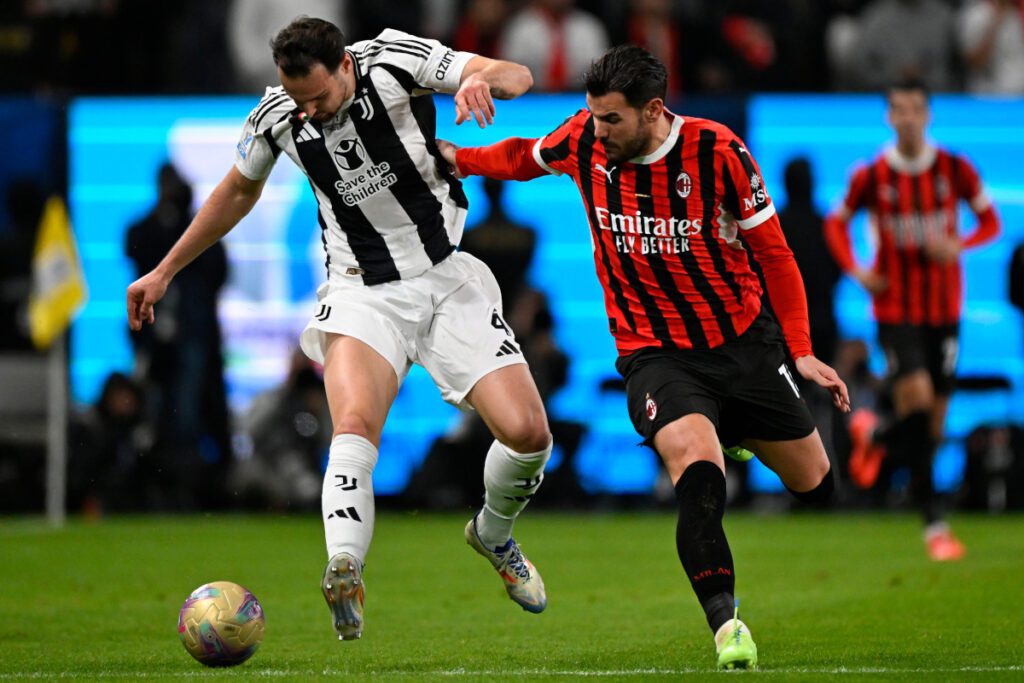 epa11804151 AC Milan's Theo Hernandez (R) in action against Juventus' Federico Gatti (L) during the Supercoppa Italiana semi-final match between Juventus FC and AC Milan, in Riyadh, Saudi Arabia, 03 January 2025. EPA-EFE/STR