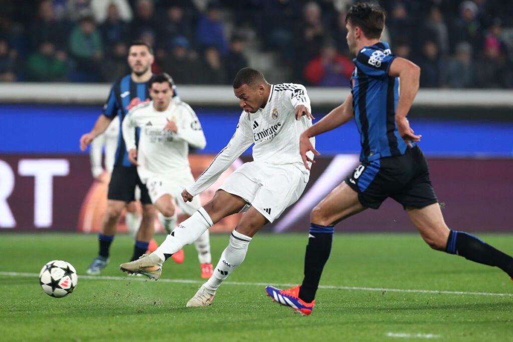 BERGAMO, ITALY - DECEMBER 10: Kylian Mbappe of Real Madrid scores his team's first goal during the UEFA Champions League 2024/25 League Phase MD6 match between Atalanta BC and Real Madrid C.F. at Stadio di Bergamo on December 10, 2024 in Bergamo, Italy. (Photo by Marco Luzzani/Getty Images)
