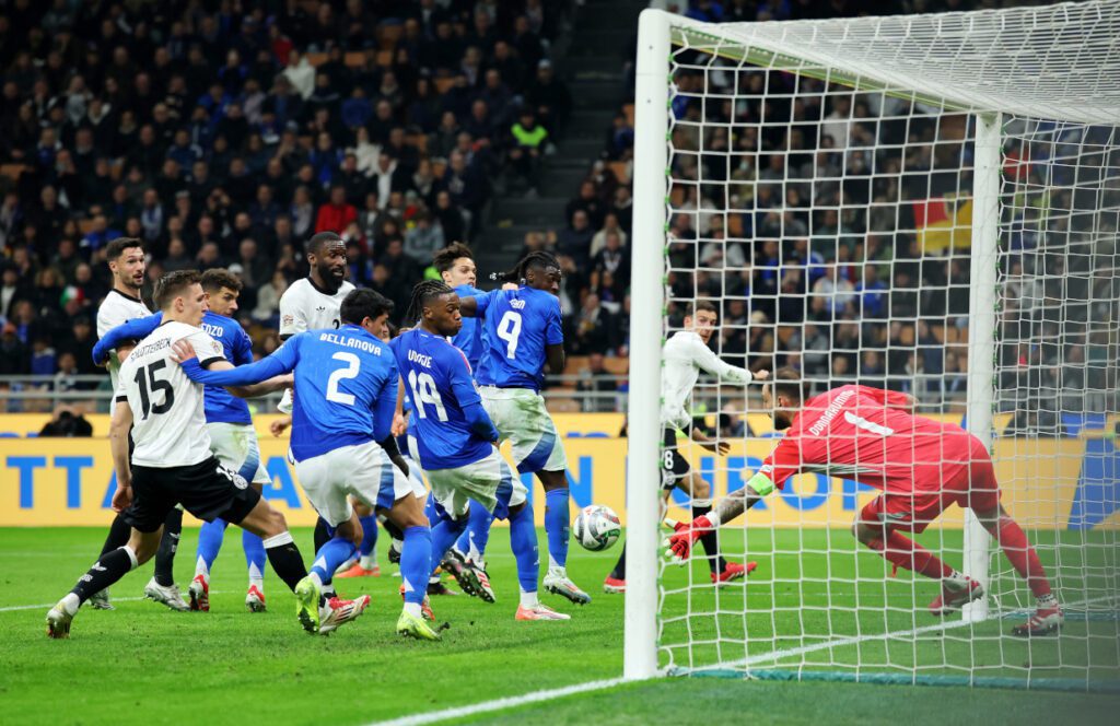 MILAN, ITALY - MARCH 20: Gianluigi Donnarumma of Italy fails to make a save as Leon Goretzka of Germany scores his team's second goal during the UEFA Nations League quarterfinal leg one match between Italy and Germany at Stadio San Siro on March 20, 2025 in Milan, Italy. (Photo by Alex Grimm/Getty Images)