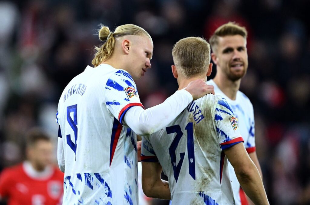 Norway’s dominant win leaves Italy with one option to avoid World Cup playoff 15 LINZ, AUSTRIA - OCTOBER 13: Erling Haaland of Norway speaks with teammate Andreas Hanche-Olsen during the UEFA Nations League 2024/25 League B Group B3 match between Austria and Norway at Raiffeisen Arena on October 13, 2024 in Linz, Austria. (Photo by Christian Bruna/Getty Images)