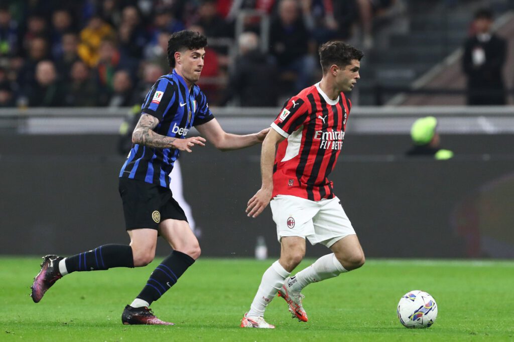 MILAN, ITALY - APRIL 02: Christian Pulisic of AC Milan gets past Alessandro Bastoni of FC Internazionale during the Coppa Italia Semi Final match between AC Milan and FC Internazionale at Stadio Giuseppe Meazza on April 02, 2025 in Milan, Italy. (Photo by Marco Luzzani/Getty Images)