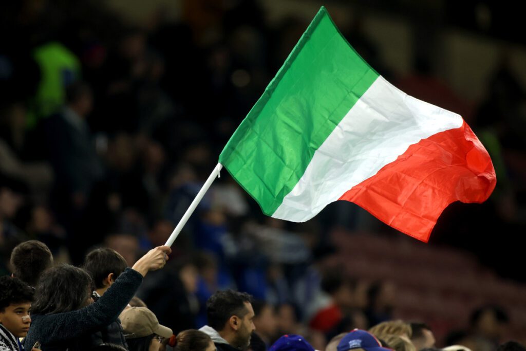 Italian Coaches’ Association call for Israel to be suspended by UEFA and FIFA 14 MILAN, ITALY - MARCH 20: An Italy flag is waved by a fan prior to the UEFA Nations League quarterfinal leg one match between Italy and Germany at Stadio San Siro on March 20, 2025 in Milan, Italy. (Photo by Alex Grimm/Getty Images)