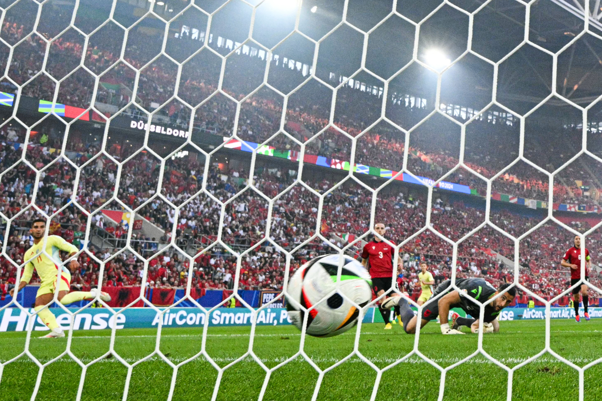 Spain's forward #11 Ferran Torres (L) scores his team's first goal past Albania's goalkeeper #23 Thomas Strakosha (R) during the UEFA Euro 2024 Group B football match between Albania and Spain at the Duesseldorf Arena in Duesseldorf on June 24, 2024. (Photo by Ina FASSBENDER / AFP) (Photo by INA FASSBENDER/AFP via Getty Images)