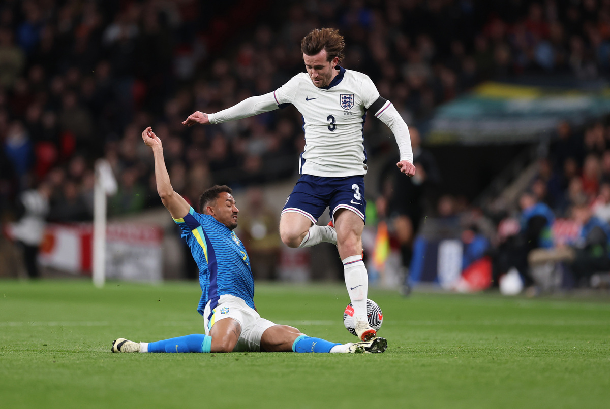 Ben Chilwell of England is tackled by Danilo of Brazil during the international friendly match between England and Brazil (and Juventus) at Wembley Stadium on March 23, 2024 in London, England. (Photo by Catherine Ivill/Getty Images)