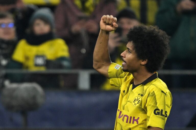 Borussia Dortmund forward #27 Karim Adeyemi celebrates scoring the opening 1-0 goal during the UEFA Champions League group F football match between BVB Borussia Dortmund and Paris Saint-Germain in Dortmund, western Germany, on December 13, 2023. (Photo by INA FASSBENDER / AFP) (Photo by INA FASSBENDER/AFP via Getty Images) (Napoli links)