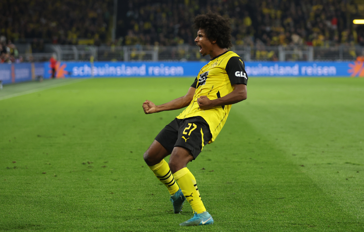 Karim Adeyemi of Dortmund celebrates scoring his team's third goal during the Bundesliga match between Borussia Dortmund and 1. FC Heidenheim 1846 at Signal Iduna Park on September 13, 2024 in Dortmund, Germany. (Photo by Lars Baron/Getty Images)