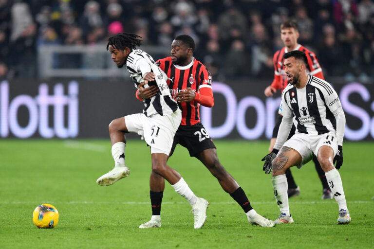 TURIN, ITALY - JANUARY 18: Samuel Mbangula of Juventus is challenged by Youssouf Fofana of AC Milan during the Serie A match between Juventus and AC Milan at Allianz Stadium on January 18, 2025 in Turin, Italy. (Photo by Valerio Pennicino/Getty Images)