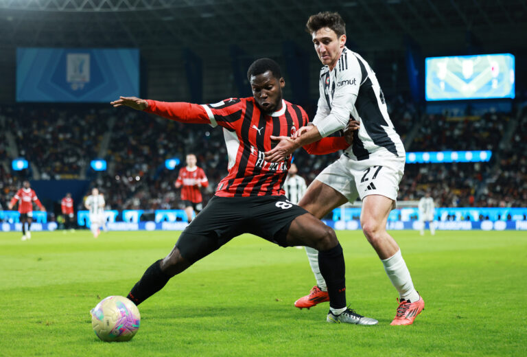 Yunus Musah of AC Milan holds off Andrea Cambiaso of Juventus during the Italian Super Cup Semi-Final match between AC Milan and Juventus at Al Awwal Park on January 03, 2025 in Riyadh, Saudi Arabia. (Photo by Abdullah Ahmed/Getty Images)