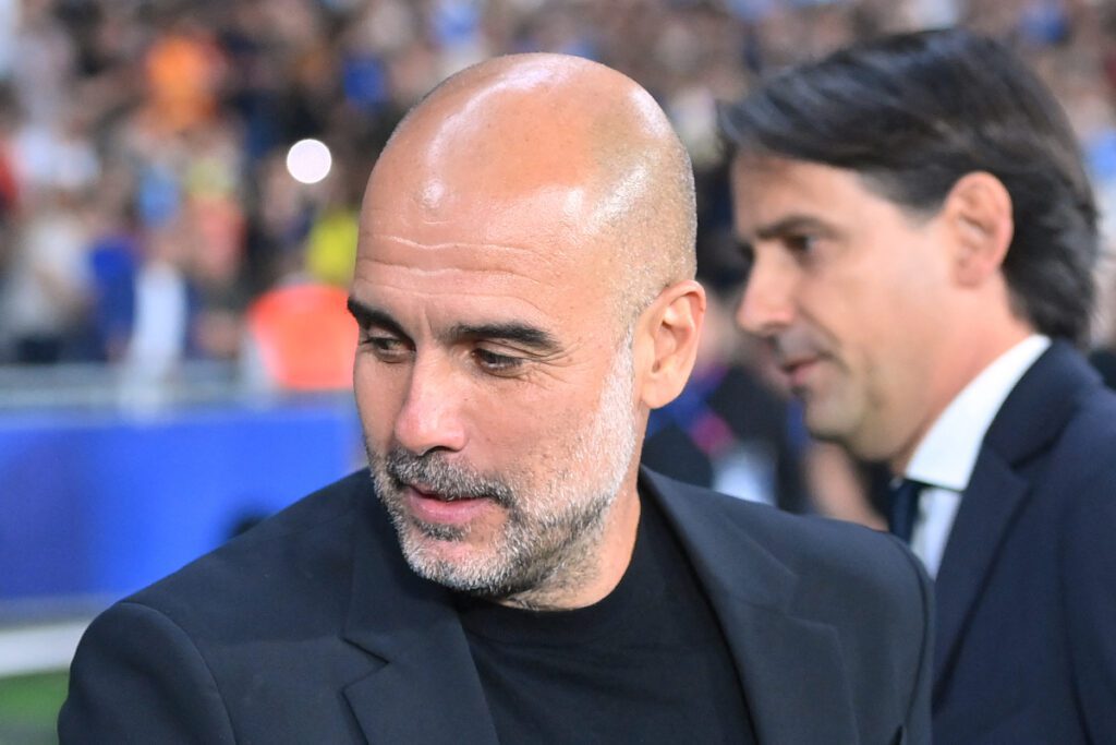 Manchester City's Spanish manager Pep Guardiola greets Inter Milan's Italian head coach Simone Inzaghi (R) during the UEFA Champions League final football match between Inter Milan and Manchester City at the Ataturk Olympic Stadium in Istanbul, on June 10, 2023. (Photo by FRANCK FIFE / AFP) (Photo by FRANCK FIFE/AFP via Getty Images)