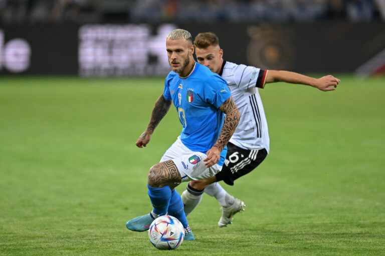 Federico Dimarco of Italy challenges Joshua Kimmich of Germany during the UEFA Nations League League A Group 3 match between Germany and Italy at Borussia Park Stadium on June 14, 2022 in Moenchengladbach, Germany. (Photo by Christian Kaspar-Bartke/Getty Images)