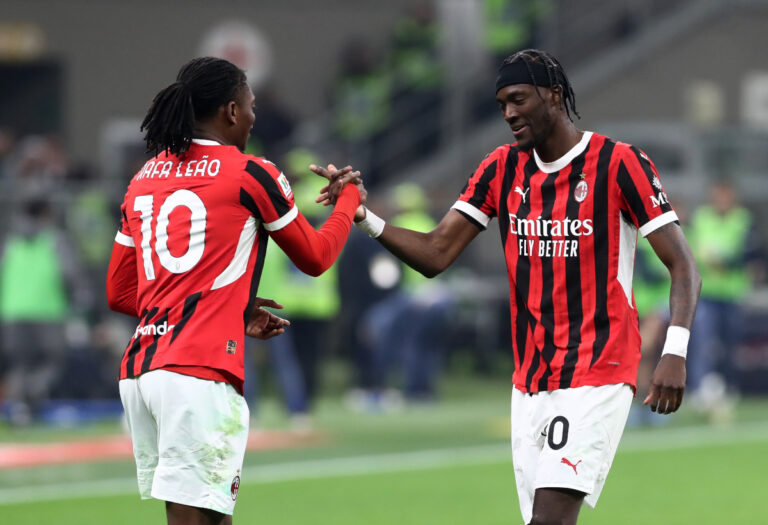 MILAN, ITALY - APRIL 02: Tammy Abraham of AC Milan (R) celebrates scoring his team's first goal with teammate Rafael Leao during the Coppa Italia Semi Final match between AC Milan and FC Internazionale at Stadio Giuseppe Meazza on April 02, 2025 in Milan, Italy. (Photo by Marco Luzzani/Getty Images)