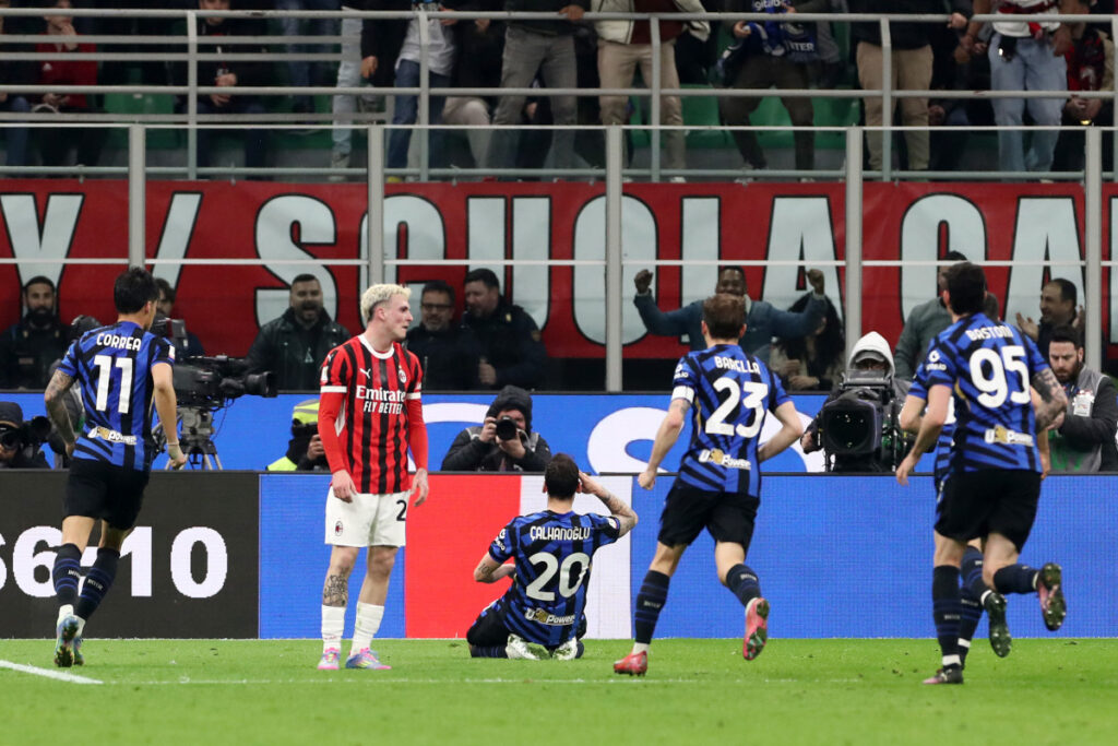 MILAN, ITALY - APRIL 02: Hakan Calhanoglu of FC Internazionale celebrates scoring his team's first goal during the Coppa Italia Semi Final match between AC Milan and FC Internazionale at Stadio Giuseppe Meazza on April 02, 2025 in Milan, Italy. (Photo by Marco Luzzani/Getty Images)