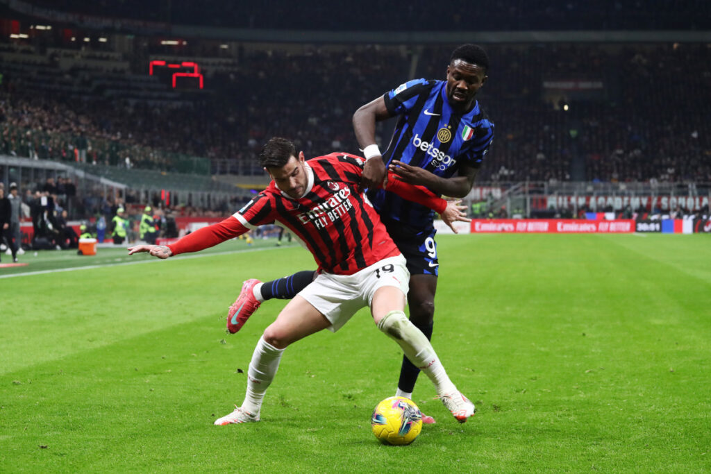 MILAN, ITALY - FEBRUARY 02: Theo Hernandez of AC Milan is put under pressure by Marcus Thuram of FC Internazionale during the Serie A match between AC Milan and FC Internazionale at Stadio Giuseppe Meazza on February 02, 2025 in Milan, Italy. (Photo by Marco Luzzani/Getty Images)
