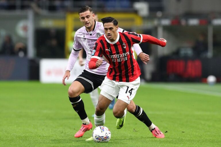 MILAN, ITALY - OCTOBER 19: Tijjani Reijnders of AC Milan competes for the ball with Axel Guessand of Udinese Calcio during the Serie A match between AC Milan and Udinese Calcio at Stadio Giuseppe Meazza on October 19, 2024 in Milan, Italy. (Photo by Marco Luzzani/Getty Images)