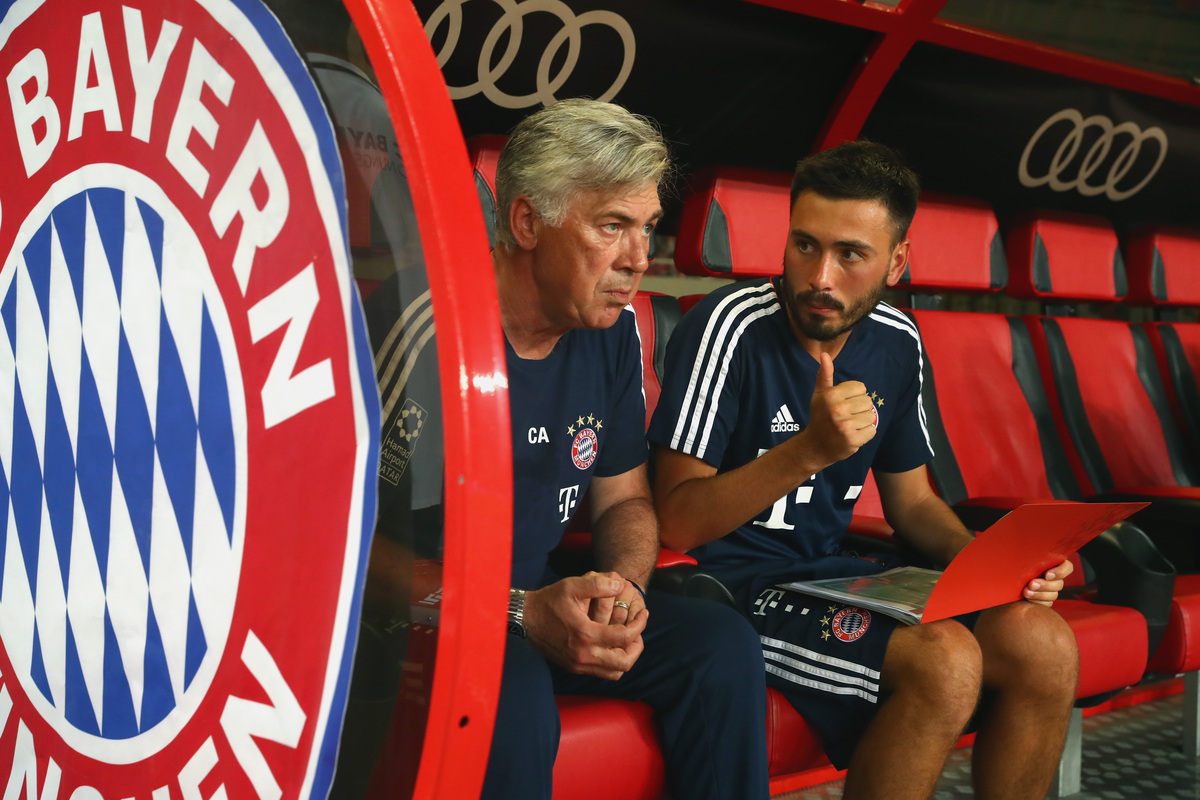 Ancelotti chooses son Davide as Brazil assistant coach 8 SHANGHAI, CHINA - JULY 19: Carlo Ancelotti, head coach of Bayern Muenchen tolks to his son and assistent coach Davide Ancelotti prior to the Audi Football Summit 2017 match between Bayern Muenchen and Arsenal FC at Shanghai Stadium during the Audi Summer Tour 2017 on July 19, 2017 in Shanghai, China. (Photo by Alexander Hassenstein/Bongarts/Getty Images)