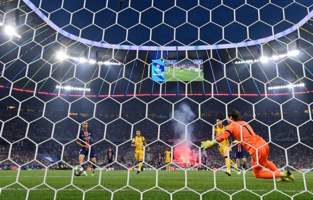 MUNICH, GERMANY - MAY 31: (EDITOR'S NOTE: Image was captured using a remote camera from behind the goal.) Achraf Hakimi of Paris Saint-Germain scores his team's first goal past Yann Sommer of FC Internazionale during the UEFA Champions League Final 2025 between Paris Saint-Germain and FC Internazionale Milano at Munich Football Arena on May 31, 2025 in Munich, Germany. (Photo by Stu Forster/Getty Images)