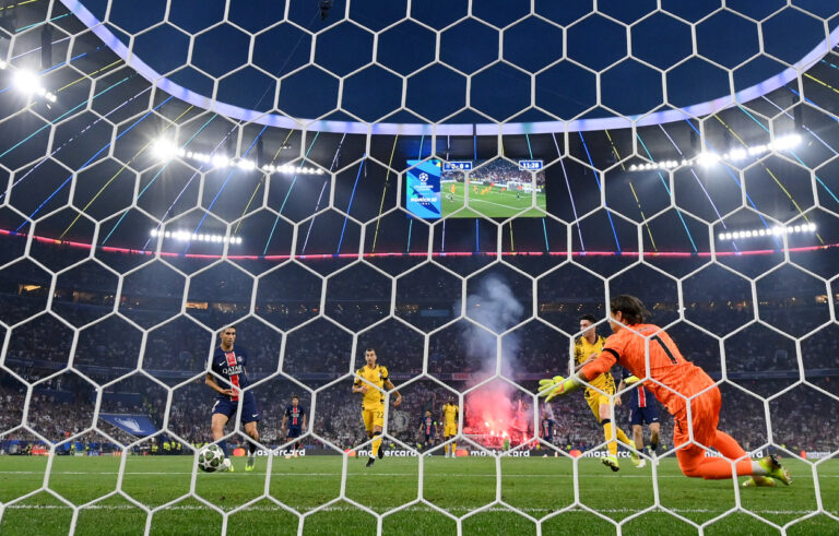 MUNICH, GERMANY - MAY 31: (EDITOR'S NOTE: Image was captured using a remote camera from behind the goal.) Achraf Hakimi of Paris Saint-Germain scores his team's first goal past Yann Sommer of FC Internazionale during the UEFA Champions League Final 2025 between Paris Saint-Germain and FC Internazionale Milano at Munich Football Arena on May 31, 2025 in Munich, Germany. (Photo by Stu Forster/Getty Images)