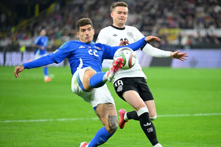 DORTMUND, GERMANY - MARCH 23: Giovanni Di Lorenzo of Italy controls the ball under pressure from Maximilian Mittelstaedt of Germany during the UEFA Nations League Quarterfinal Leg Two match between Germany and Italy at Football Stadium Dortmund on March 23, 2025 in Dortmund, Germany. (Photo by Stuart Franklin/Getty Images)