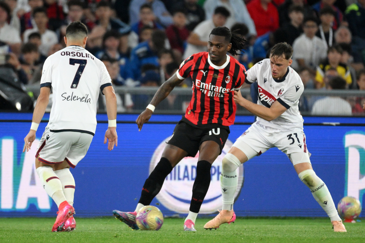 Napoli ready to send offer as Beukema pushes for transfer 6 ROME, ITALY - MAY 14: Rafael Leao of AC Milan is challenged by Sam Beukema of Bologna during the Coppa Italia Final match between AC Milan and Bologna at Stadio Olimpico on May 14, 2025 in Rome, Italy. (Photo by Marco Rosi/Getty Images)