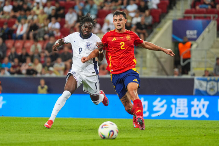 TRNAVA, SLOVAKIA - JUNE 21: Jonathan Rowe of U21 England in action against Marc Pubill of U21 Spain during the UEFA European Under-21 Championship 2025 Quarter-Final match between Spain and England at A. Malatinsky Stadium on June 21, 2025 in Trnava, Slovakia. (Photo by Christian Hofer/Getty Images)