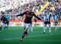 UDINE, ITALY - DECEMBER 01: Andrea Pinamonti of Genoa celebrates scoring the opening goal during the Serie A match between Udinese and Genoa at Stadio Friuli on December 01, 2024 in Udine, Italy. (Photo by Timothy Rogers/Getty Images)