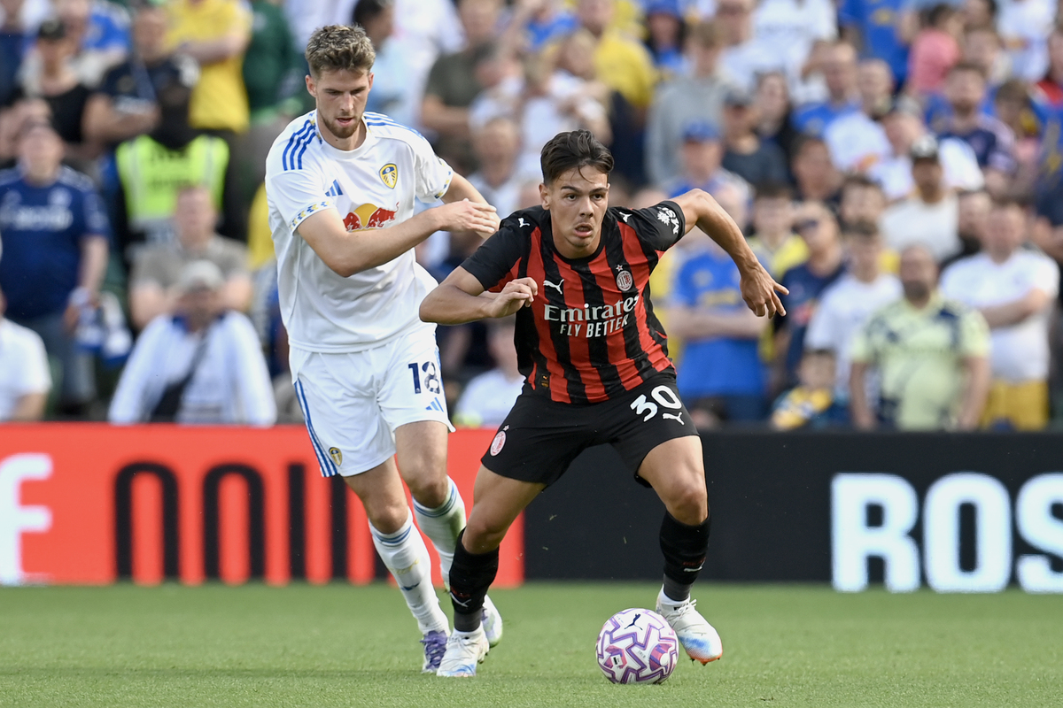 DUBLIN, IRELAND - AUGUST 09: Ardon Jashari of AC Milan runs with the ball under pressure from Anton Stach of Leeds United during the pre-season friendly match between Leeds United and AC Milan at Aviva Stadium on August 09, 2025 in Dublin, Ireland. (Photo by Charles McQuillan/Getty Images)