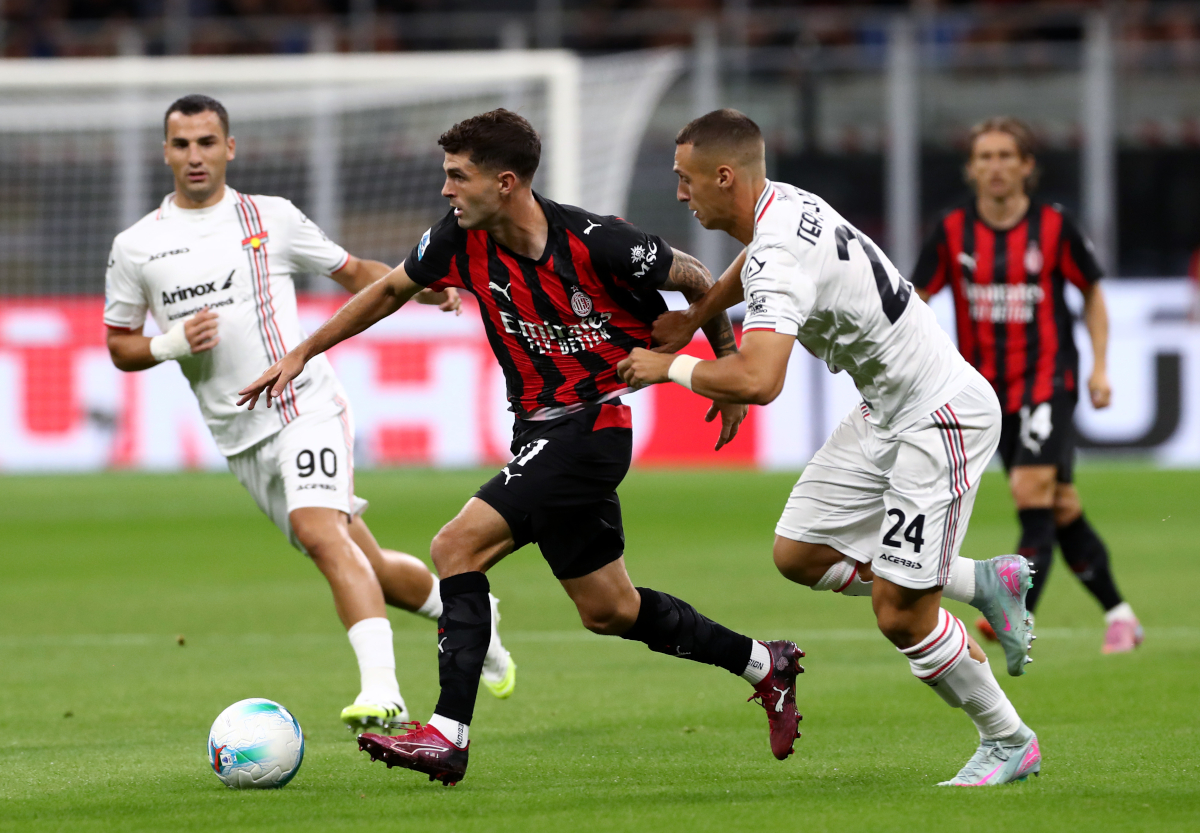 Serie A | Milan 1-2 Cremonese: Modric shocked by minnows 132 MILAN, ITALY - AUGUST 23: Christian Pulisic of AC Milan runs with the ball whilst under pressure from Filippo Terracciano of Cremonese during the Serie A match between AC Milan and US Cremonese at Giuseppe Meazza Stadium on August 23, 2025 in Milan, Italy. (Photo by Marco Luzzani/Getty Images)