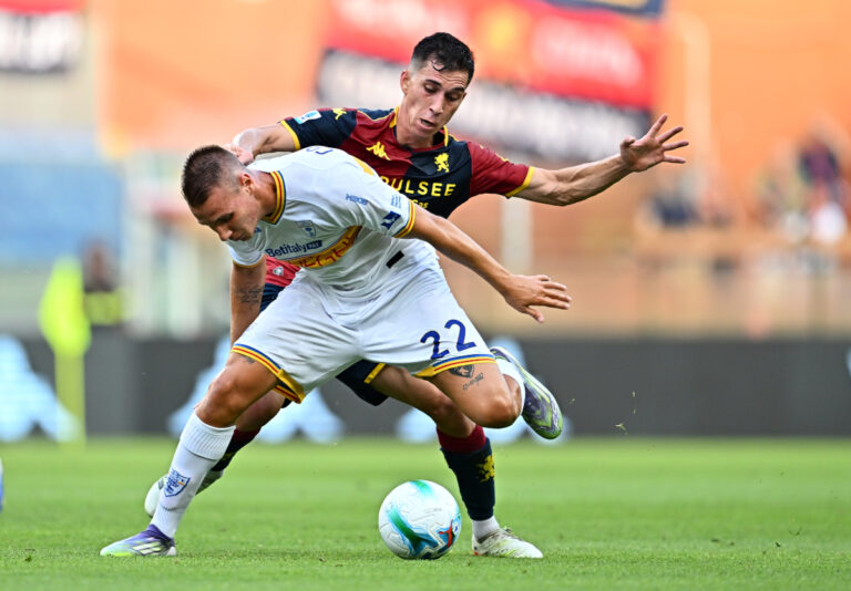 GENOA, ITALY - AUGUST 23: Francesco Camarda of Lecce is challenged by Patrizio Masini of Genoa during the Serie A match between Genoa CFC and US Lecce at Luigi Ferraris Stadium on August 23, 2025 in Genoa, Italy. (Photo by Simone Arveda/Getty Images)