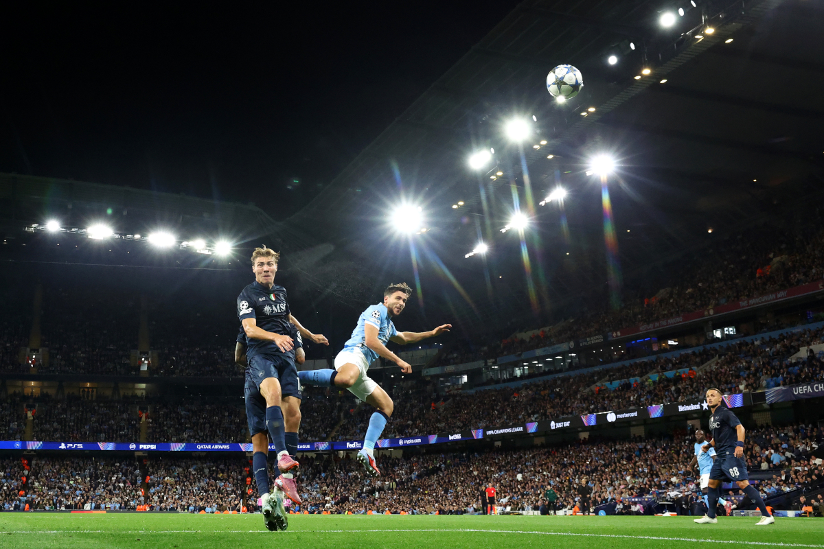 MANCHESTER, ENGLAND - SEPTEMBER 18: Nico Gonzalez of Manchester City has a headed shot whilst under pressure from Rasmus Hojlund of Napoli during the UEFA Champions League 2025/26 League Phase MD1 match between Manchester City and SSC Napoli at City of Manchester Stadium on September 18, 2025 in Manchester, England. (Photo by Dan Istitene/Getty Images)