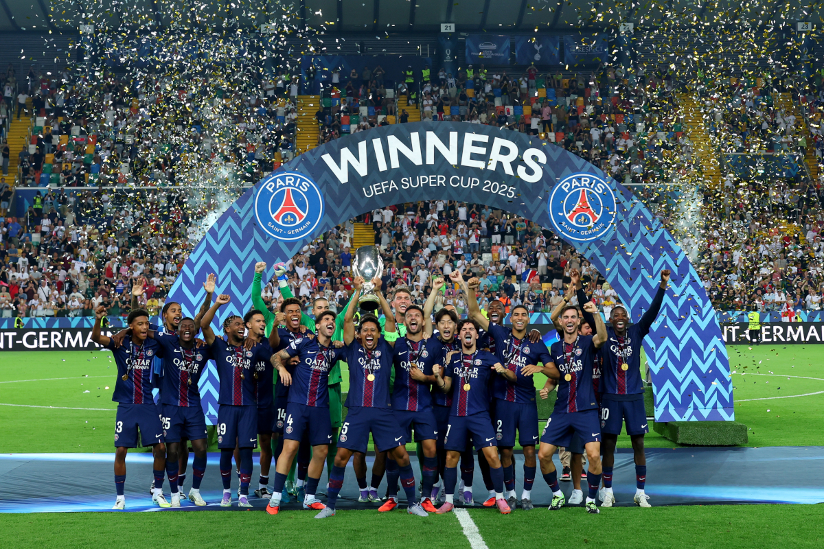UDINE, ITALY - AUGUST 13: Marquinhos of Paris Saint-Germain lifts the UEFA Super Cup Trophy after his team's victory in the UEFA Super Cup 2025 match between Paris Saint-Germain and Tottenham Hotspur at Stadio Friuli on August 13, 2025 in Udine, Italy. (Photo by Francesco Scaccianoce/Getty Images)